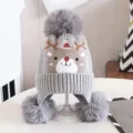 Kids grey knitted beanie hat with cute reindeer pattern and three pom poms winter warm - Gray