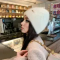 Stylish white knit beanie for women, cozy winter warm fuzzy pullover cap with cute metal decor. - One Size / White