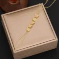 Detailed close-up of a stunning gold-plated butterfly hand chain with sparkling cubic zirconia. - Style 3