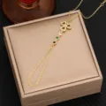 Close-up detail of gold hand chain with sparkling cubic zirconia and colorful crystal accents. - Style 4