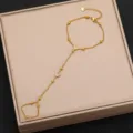 Gold tone titanium steel finger bracelet with heart zirconia, elegant hand chain jewelry. - Style 4
