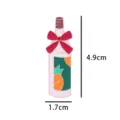 Detailed view of the cute wine bottle enamel pin featuring a red bow and pineapple design. - JC1301 / Without Card