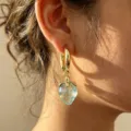 Chic gold hoop earrings featuring a translucent light blue strawberry pendant, elegant ins style. - Blue