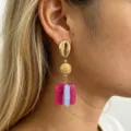 Detailed close-up of French retro color-blocked resin earrings with shell stud and drop. - Blue + Rose Red