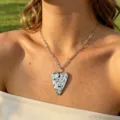 Stainless steel heart pendant necklace detailed view, modern paperclip chain jewelry style. - Silver