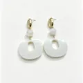 Close-up of stylish resin geometric dangle earrings with retro cowrie shell top and white bead. - 5#