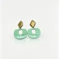 Close-up detail of geometric resin earrings with gold rhombus and mint green pendant. - 1# (Mint Green)