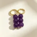 Detailed shot of gold-plated hoop earrings featuring triple purple bead dangles for women. - 1# Gold