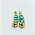 Close-up detail of vintage style turquoise disc and gold teardrop dangle earrings. - Size 7