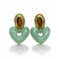 Close-up detail of green marbled resin hollow heart earrings with vintage gold oval top studs. - Green