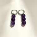 Detailed shot of purple crystal bead hoop earrings, featuring unique dangling design. - No.1 Silver