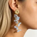 Sweet long resin flower drop earrings in light blue with gold metal stud for women stylish wear. - Fog Blue