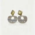Close-up detail view of retro geometric resin agate earrings with textured gold top piece. - 6# Agate Style