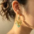 Chic gold-plated metal flower earrings with green bead dangling, stylish summer jewelry. - Lake Blue