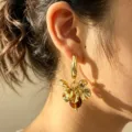 Exaggerated metal flower hoop earrings with chic bead pendant for stylish women summer daily wear. - Amber