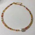 Detailed close-up of handmade beaded choker necklace with colorful natural stones and pearl pendant. - 2#