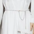 Detailed view of the elegant pearl waist chain, featuring delicate hanging drape design. - Silver Tone