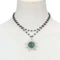 Double layer black beaded necklace with green sun pendant fashion jewelry detail shot. - Green Aventurine