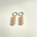 Detail view of minimalist triple-bead drop earrings with silver metal hoops and natural stones. - No.3 Silver