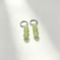 Minimalist green stone bead hoop earrings detail shot showcasing delicate metallic texture. - Size 9 Silver