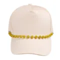 Close-up of beige baseball cap featuring sparkling yellow rhinestone ball chain detail. - Yellow