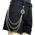 Detail shot of a punk multi-layer silver metal waist chain with a pentagram pendant on shorts. - Pentagram Pants Chain / Silver Tone
