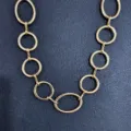 Detailed shot of a punk style gold metal chain belt, perfect for hip-hop waist styling. - Metal O-Ring Waist Chain (Gold)