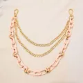 Detailed view of trendy multi-layer pink resin and gold metal chain, perfect pants and bag accessory. - Trousers Chains (Pink)