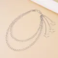 Close-up detail of silver multi-layer metal waist chain with cute star pendants for women. - Star Charm / White K/Silver