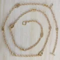 Detailed view of gold metal anchor chain waist belt, featuring unique pig nose links and clasp. - Style 2 / Gold