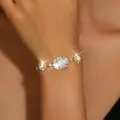 Bracciale in cristallo e strass dorato da donna, accessorio di gioielli da sera elegante. - Bracciale / Oro