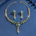 Elegant gold-tone bridal jewelry set featuring green crystal stones and sparkling rhinestones. - Leaf Tassel Necklace Earrings Set (MS291-3) / Green