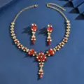 Detailed view of gold tone red rhinestone necklace and earrings set, elegant jewelry detail. - Leaf Tassel Necklace Earrings Set (MS291-4) / Red