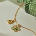 Stunning gold-plated necklace featuring sparkling teardrop and floral cubic zirconia pendants. - Yellow Drop Green Flower Zirconia Style (KN0696) / 1 Piece