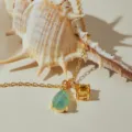 Gold-plated necklace featuring a green teardrop and yellow round zircon gemstone pendants. - Green Drop Yellow Round Zirconia Style (KN0697) / 1 Piece
