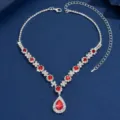 Exquisite silver teardrop necklace featuring dazzling red crystals and sparkling rhinestones. - Red
