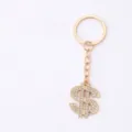 Gold rhinestone dollar sign keychain, sparkling crystal alloy bag pendant and metal ring. - Light gold