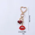Gold-tone heart keychain with red lips pendant, stylish bag charm and purse accessory. - Red Lips Style / Red Lips