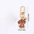 Porte-clés en métal en forme de chien teckel de dessin animé mignon avec clochette pour enfants. - Teckel à cloche