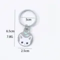 Cute cat cartoon metal keychain with fish pendant, round pet tag and car decoration accessory. - White Cat Figurine