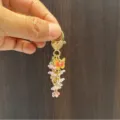 Exquis porte-clés papillon fleur doré élégant charmant sac de femme accessoire cadeau. - Chaîne de Fleurs Roses