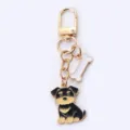 Porte-clés chiot mignon avec breloque os, anneau de clé en métal doré pour sac, téléphone, cadeau. - Chien Noir et Os