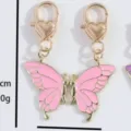 Pink enamel butterfly zinc alloy charm with heart clasp for necklace bracelet bag pendant. - One Pair / Pink