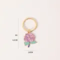 Detailed view of the enamel hydrangea flower keyring, displaying fine craftsmanship and size. - Hydrangea
