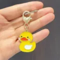 Cute yellow duck keychain bag charm with heart clasp, cartoon metal pendant for women. - Large Swimming Duck