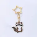 Cute cartoon raccoon keychain with star clasp, stylish metal animal pendant for bags and keys. - Raccoon