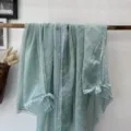 Sage green cotton linen scarf with elegant white lace trim, versatile literary shawl. - Teal