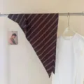 Korean striped triangular scarf detail showing dark brown fabric with fine white diagonal lines. - Dark Brown