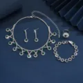Elegante zilverkleurige sieradenset met groene kristallen, ketting, oorbellen, armband. - Groen