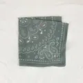 Detailed view of a dark green paisley square scarf, soft breathable fabric for elegant women's wear. - Green